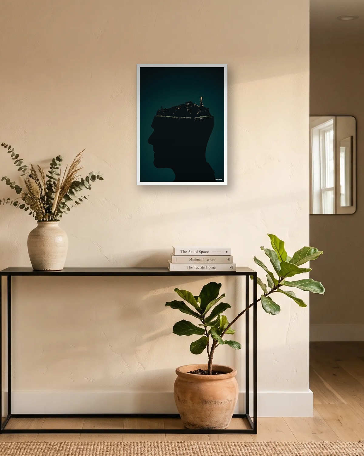 Affiche minimaliste vert sombre avec un profil en silhouette et une île surmontée d'un phare, encadrée en blanc au-dessus d'une console d'entrée