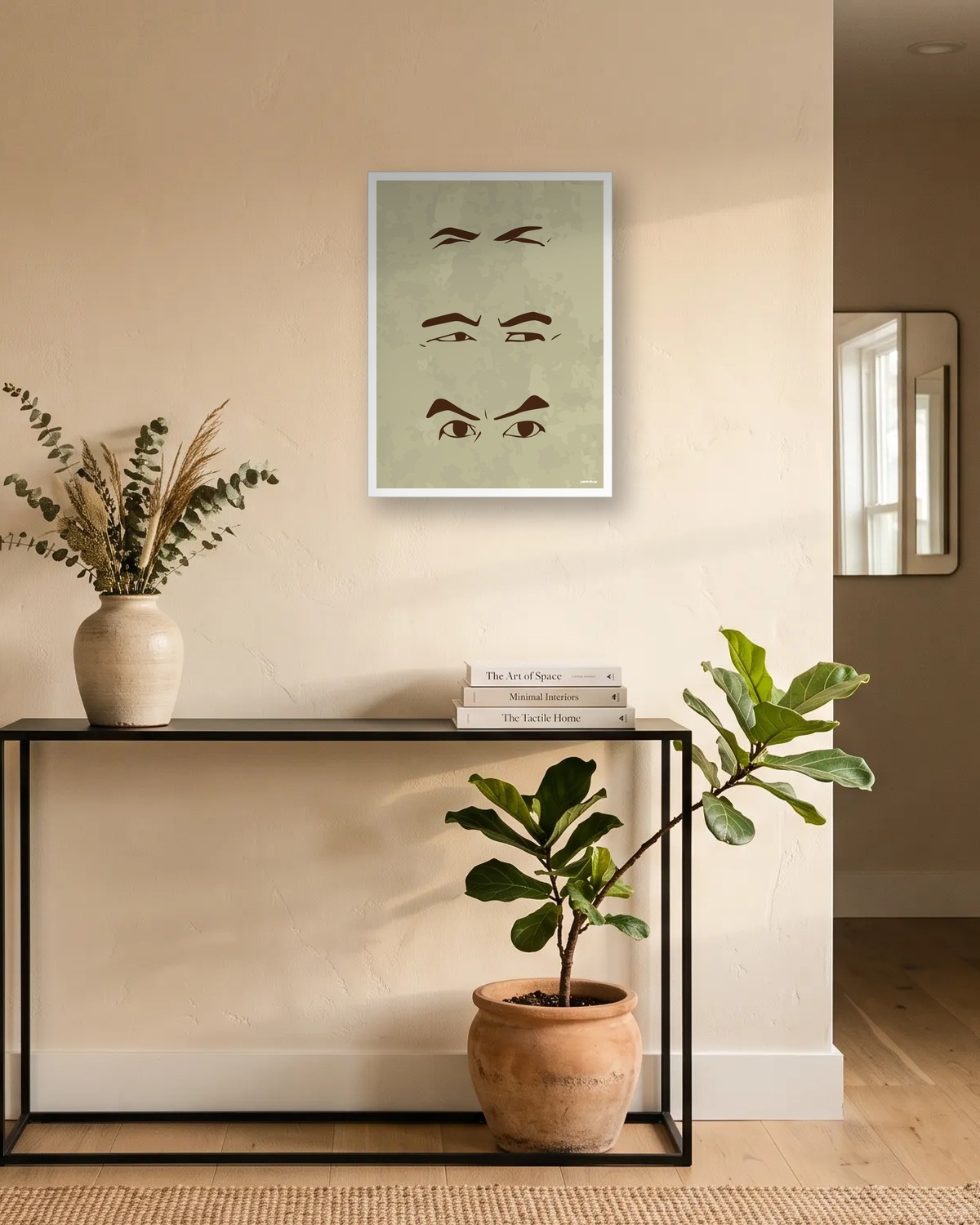 Idée de cadeau original pour homme : affiche minimaliste beige avec trois paires d'yeux plissés, au-dessus d'une console